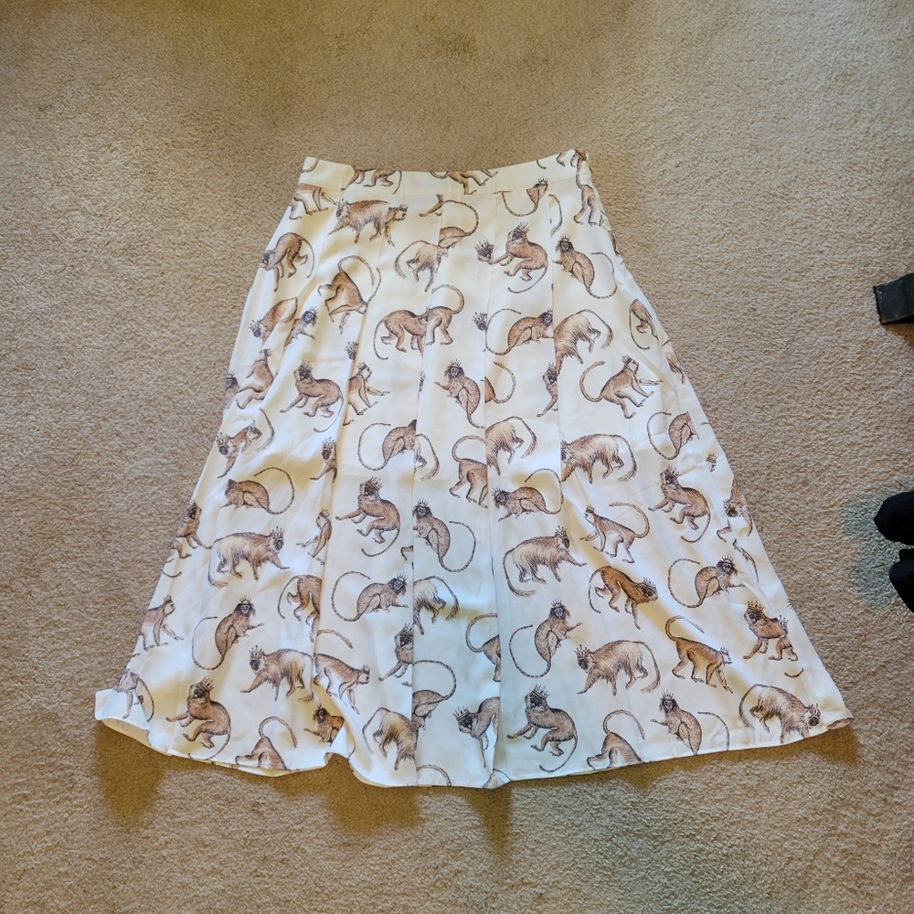 White pleated monkey skirt